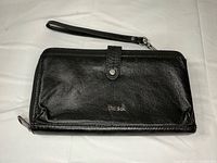 Front view of black leather phone clutch wallet with wrist strap