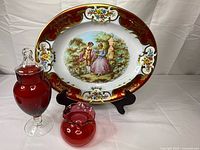 Full lot showing Daher oval tray on stand with two red glass vessels