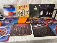 Group shot of 13 LPs displayed on table