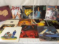 All 14 LP jackets displayed front and back row