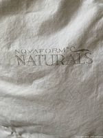 Close-up of NOVAFORM Naturals logo on duvet fabric