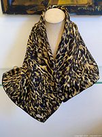 Scarf draped on mannequin showing overall pattern and size