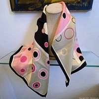 Scarf draped on mannequin showing overall size and pattern