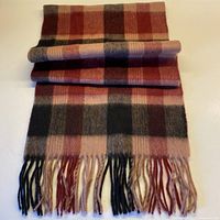 Full view of folded check wool scarf showing fringe