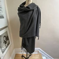 Shawl draped on mannequin front view showing length and drape