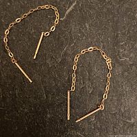 Pair of gold chain earrings showing full length and posts