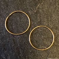 Both hoop earrings side by side
