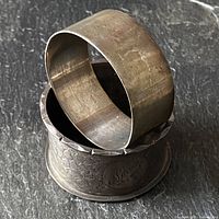 Both napkin rings, plain ring resting on engraved ring