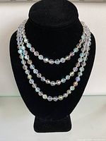Necklace displayed on bust showing three graduated strands