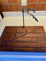 Full view of cutting board with fork attached