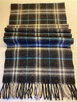 Full view of folded scarf showing pattern and fringe