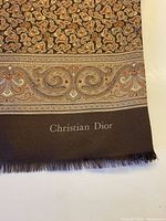 Christian Dior logo, paisley design, fringe edge visible