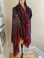 Scarf draped on mannequin showing overall size and colour pattern