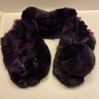 Full view of rabbit fur scarf laid flat