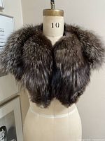 Front view of fox fur wrap on mannequin showing overall color and shape