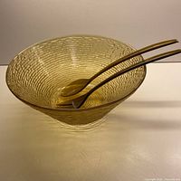 Amber textured bowl with utensils inside