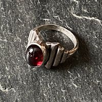 Top view showing red cabochon and stepped silver frame