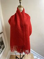 Scarf draped on mannequin showing size and drape