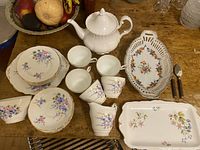 Overview of the complete chinaware and utensils lot on table