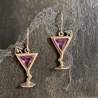 Both earrings laid out to show full shape and stones