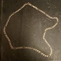 Entire Figaro chain laid flat