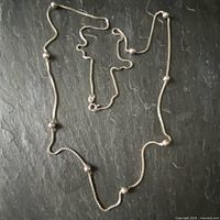 Full view of sterling silver box chain necklace with spaced spheres