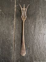 Full view of sterling silver serving fork front