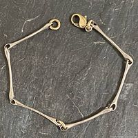 Full view of sterling silver bracelet laid in circle showing links and clasp