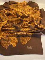 Full view of folded Chanel silk scarf showing pattern and size