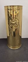 Front view showing brass umbrella stand and crest emblem