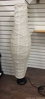 Full view of Ikea floor lamp showing paper shade and base