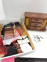 Full lot showing jewelry box, box of assorted pouches, and keys