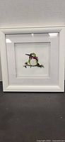 Full view of framed quilling hummingbird artwork