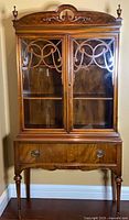 Front view of Landstrom china cabinet showing glass doors and lower drawer