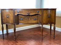 Full view of walnut sideboard front and legs