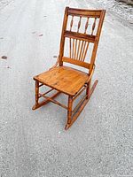 Front three-quarter view of spindle-back rocking chair