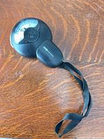 Front view showing dial and wrist strap attached