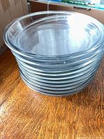 Side view of stacked clear glass pie plates