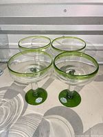 Set of four margarita glasses as arranged