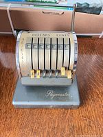 Front angled view showing full Paymaster X-550 adding machine