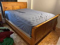 Full view of assembled pine queen sleigh bed