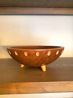 Side view showing atomic dot inlays and feet