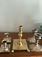 Group shot of all five candlesticks showing materials and styles