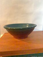 Side view of handmade glazed pottery bowl