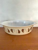 Top view of oval Pyrex casserole showing interior and handle design