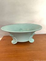 Side view showing overall shape and footed base