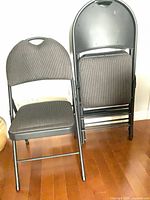 Front view showing one chair unfolded and three folded