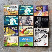 All 11 Far Side books laid out in 3x4 grid