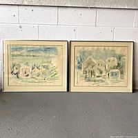 Both framed watercolour paintings side by side
