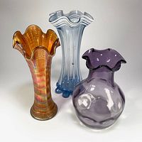 Group shot of three ruffled glass vases